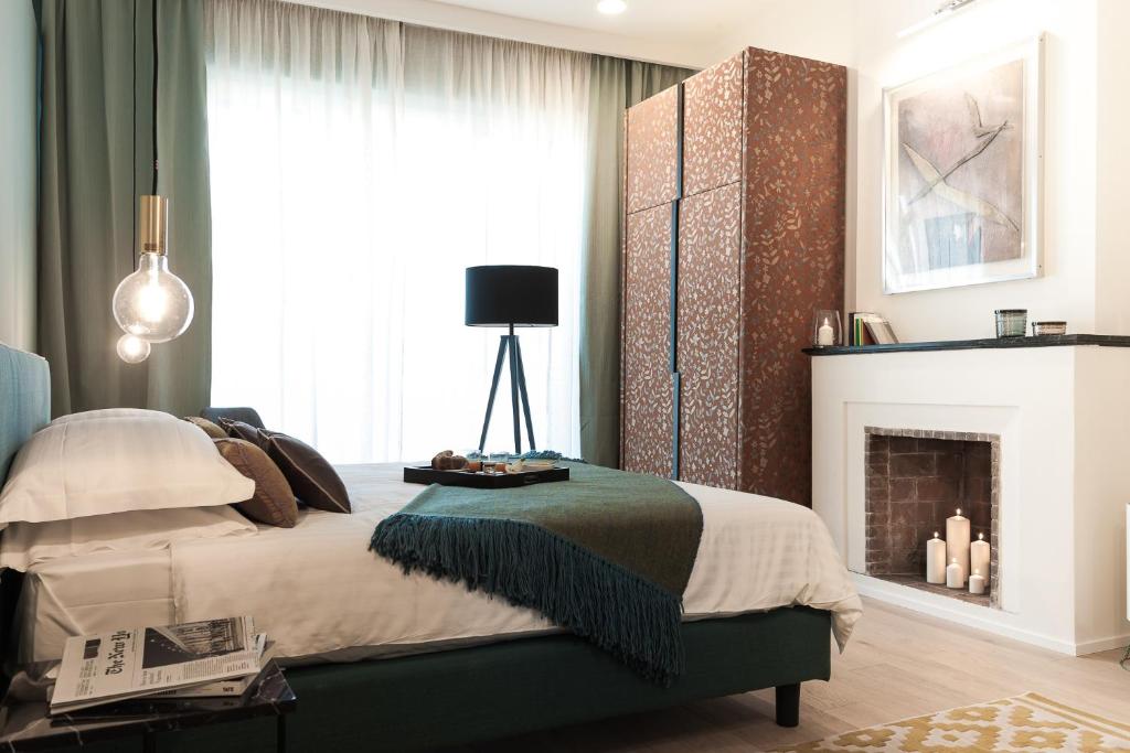 Postel nebo postele na pokoji v ubytování B&B Lorena Suites