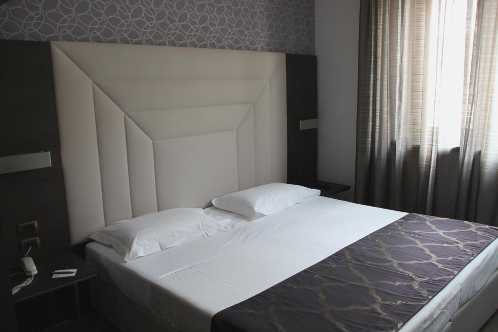 Postel nebo postele na pokoji v ubytování Hotel Soperga