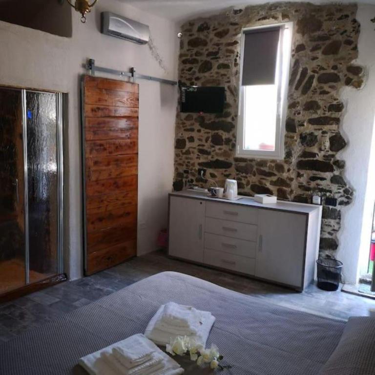 Łóżko lub łóżka w pokoju w obiekcie La Cantinetta di Sve