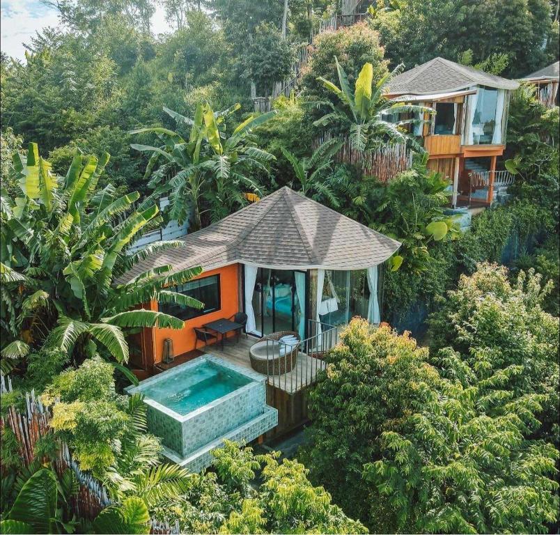 an aerial view of a house with a swimming pool at Sametnangshe Boutique in Phangnga