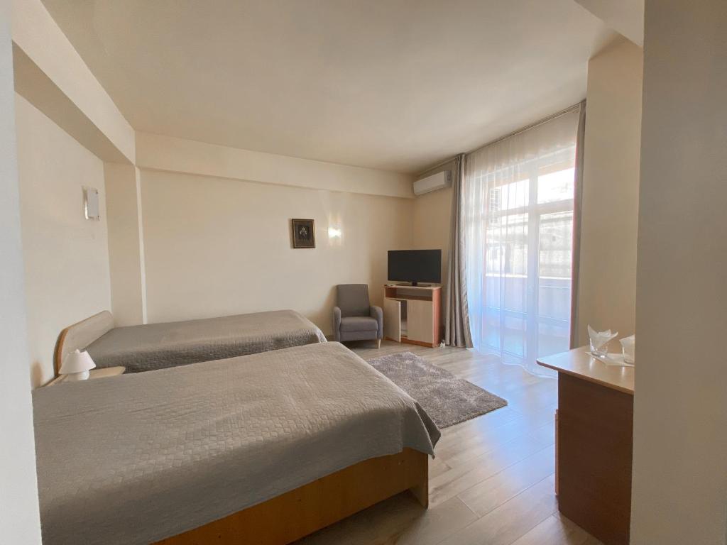 Postel nebo postele na pokoji v ubytování Hotel Class