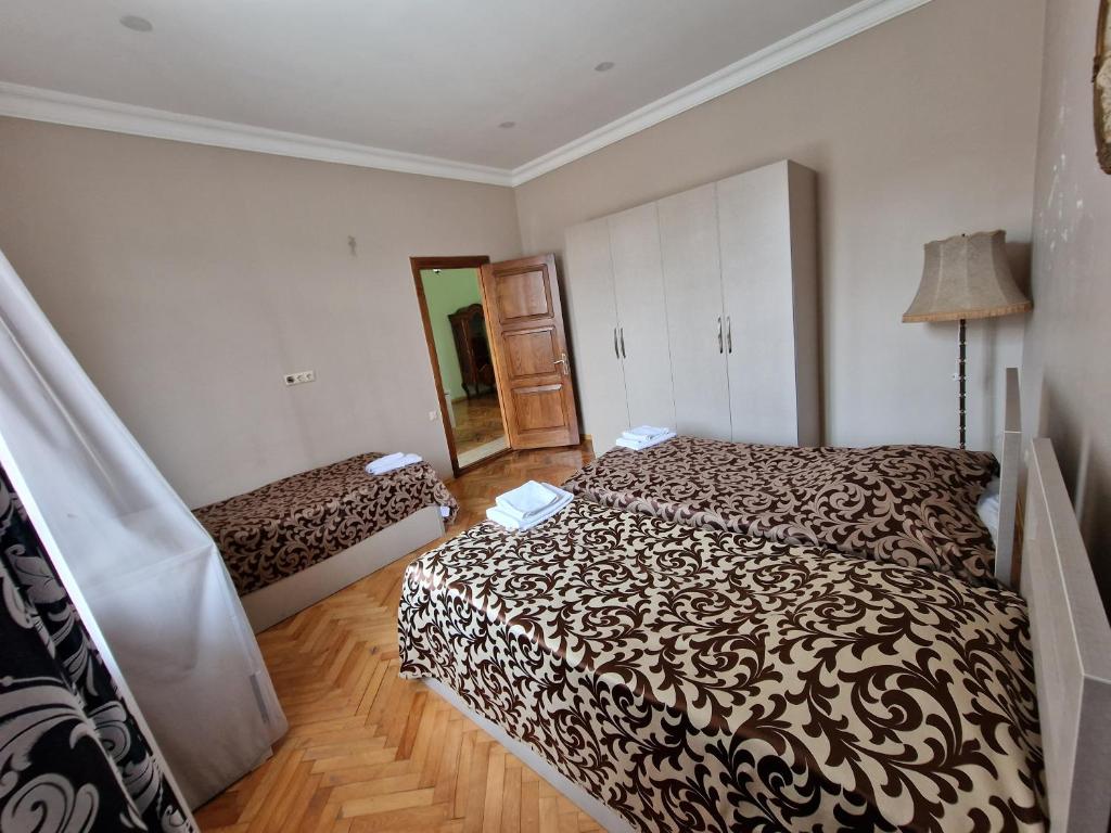 Postel nebo postele na pokoji v ubytování CATTALEYA