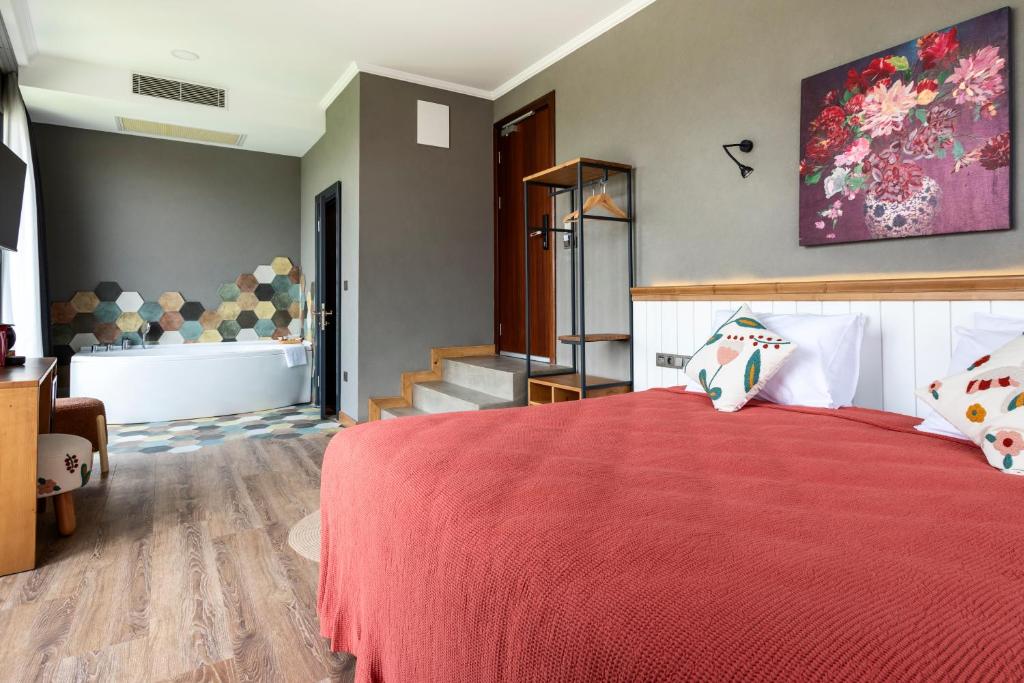 A bed or beds in a room at Istanbul Old City Colorful Houses Balat PETRION Hotel