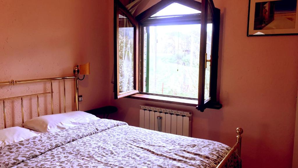 Postel nebo postele na pokoji v ubytování Pian d'Isola