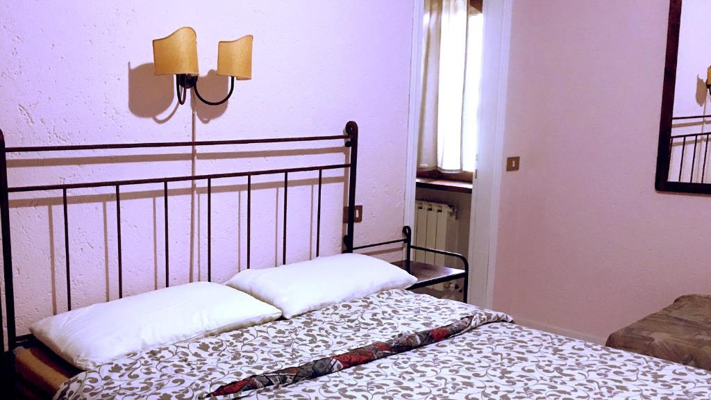 Postel nebo postele na pokoji v ubytování Pian d'Isola