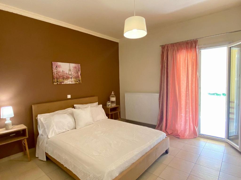 Postel nebo postele na pokoji v ubytování Sweet Home Vassia