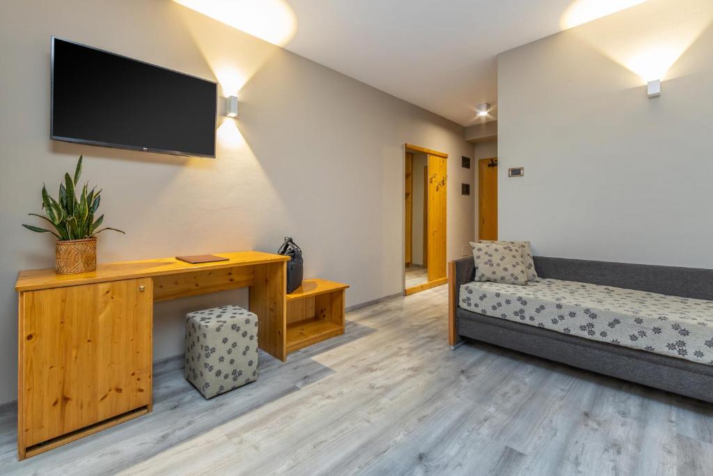 Postel nebo postele na pokoji v ubytování Hotel Vittoria - Ricarica l'anima