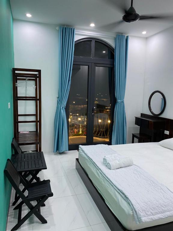 Postel nebo postele na pokoji v ubytování Lex Homestay Hotel