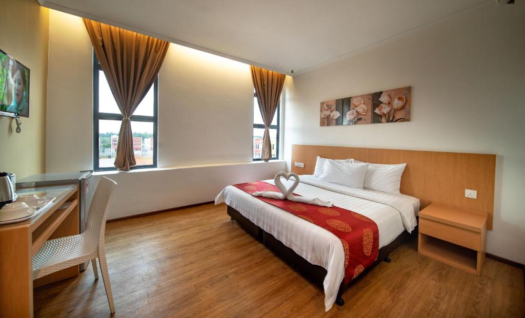 Postel nebo postele na pokoji v ubytování 1 Million Hotel