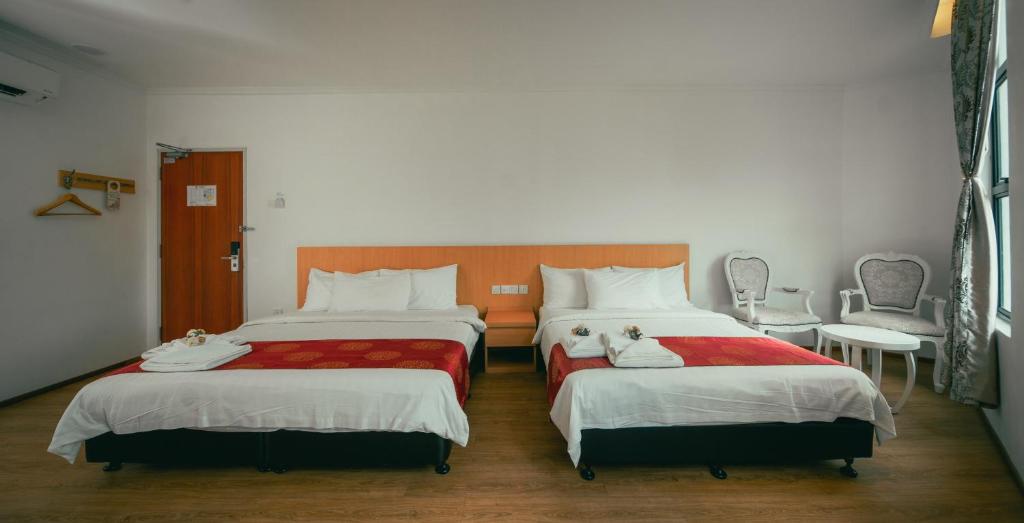 Postel nebo postele na pokoji v ubytování 1 Million Hotel