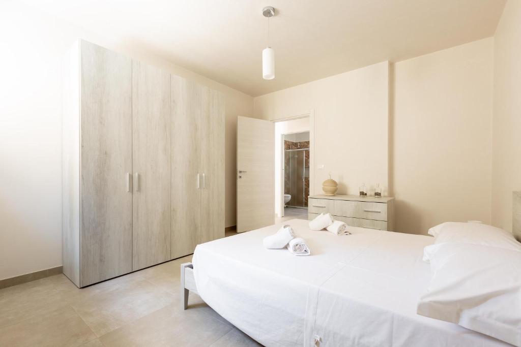 Łóżko lub łóżka w pokoju w obiekcie Villa La Seta by Perle di Puglia