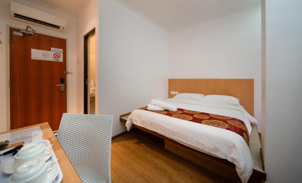 Postel nebo postele na pokoji v ubytování 1 Million Hotel