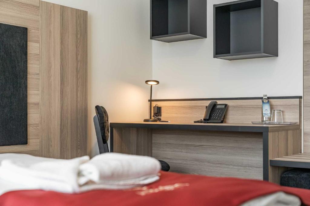 Postel nebo postele na pokoji v ubytování Abasto Hotel Dachau