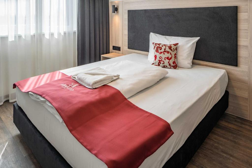 Postel nebo postele na pokoji v ubytování Abasto Hotel Dachau