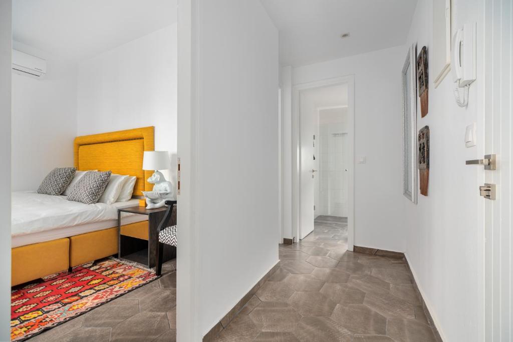 Posteľ alebo postele v izbe v ubytovaní Mare Gaia Apartments