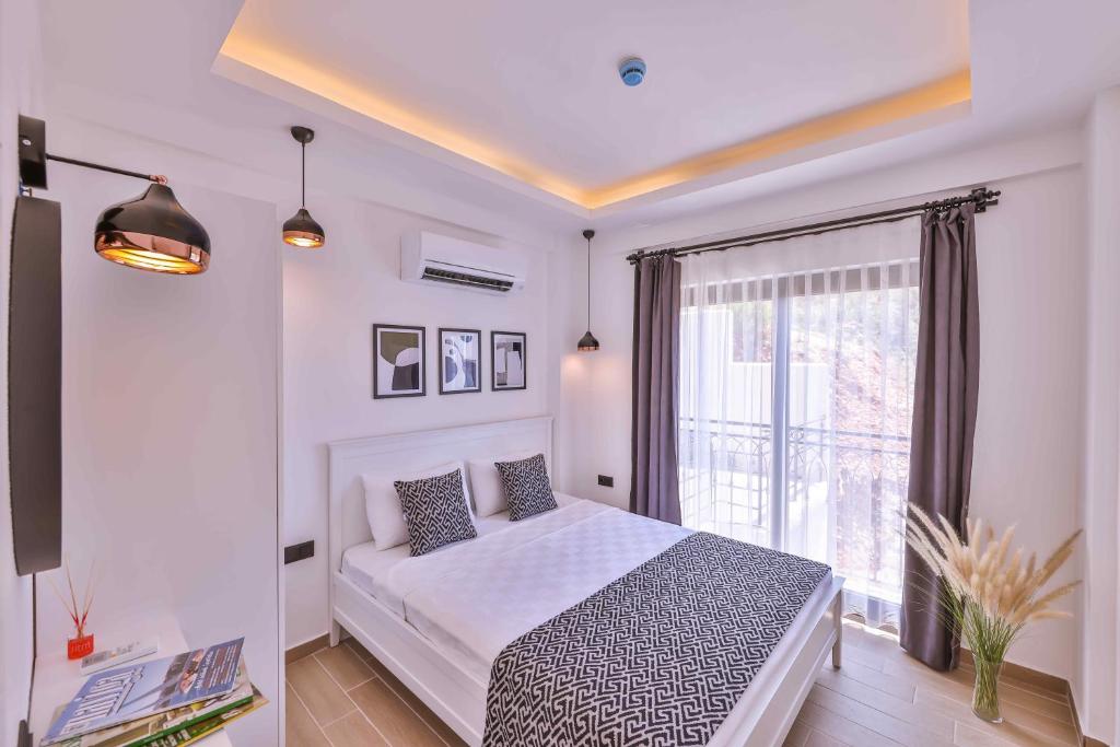 Postel nebo postele na pokoji v ubytování Lobelya Suites