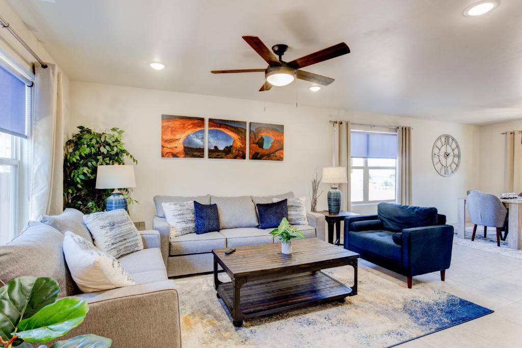 a living room with a couch and a ceiling fan at Luxury 2 Bedroom Condos - Moab Elevated in Moab