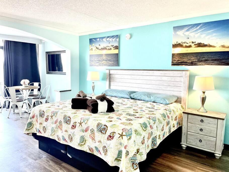 a bedroom with a bed with a teddy bear on it at *BEACH, COMFY, SUNNY* *Great Pools, Hot Tubs, Lazy Rive & More*S44 in Myrtle Beach