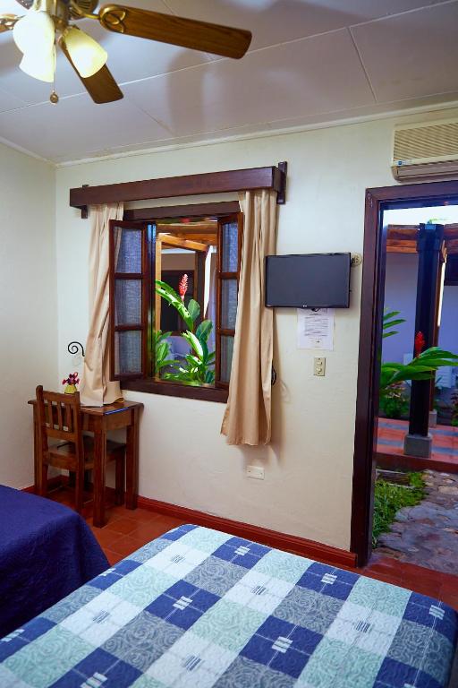Postel nebo postele na pokoji v ubytování La Posada Copan