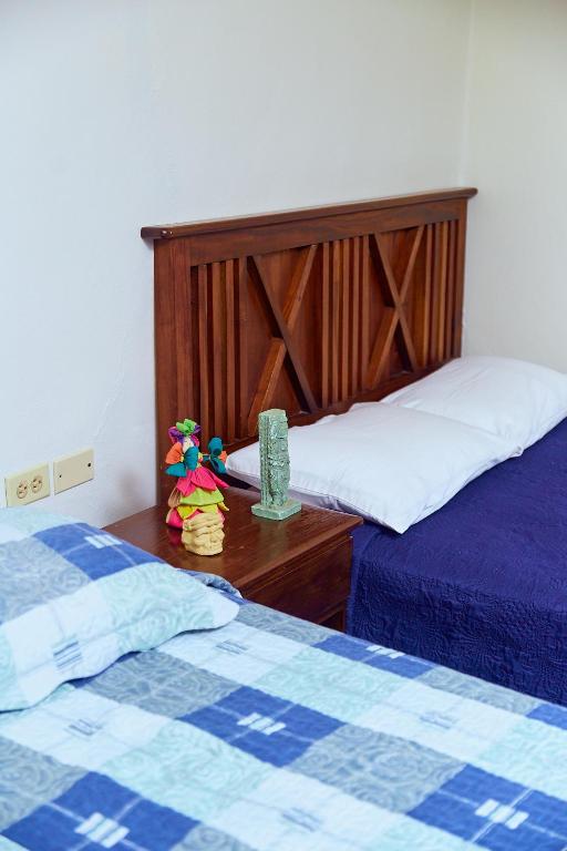 Postel nebo postele na pokoji v ubytování La Posada Copan