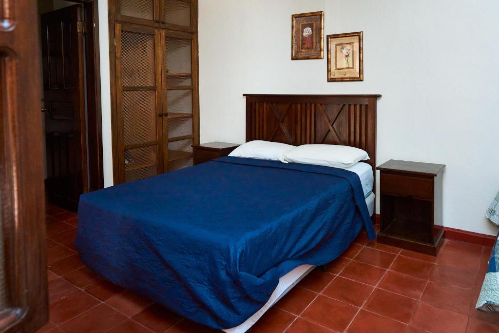 Postel nebo postele na pokoji v ubytování La Posada Copan
