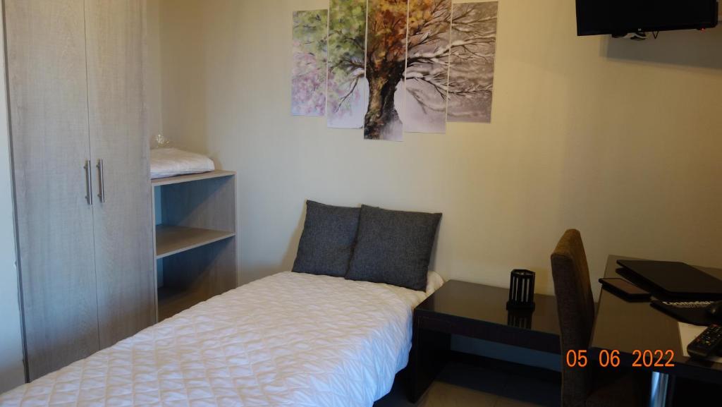 Łóżko lub łóżka w pokoju w obiekcie VAGGELIO Rooms 1