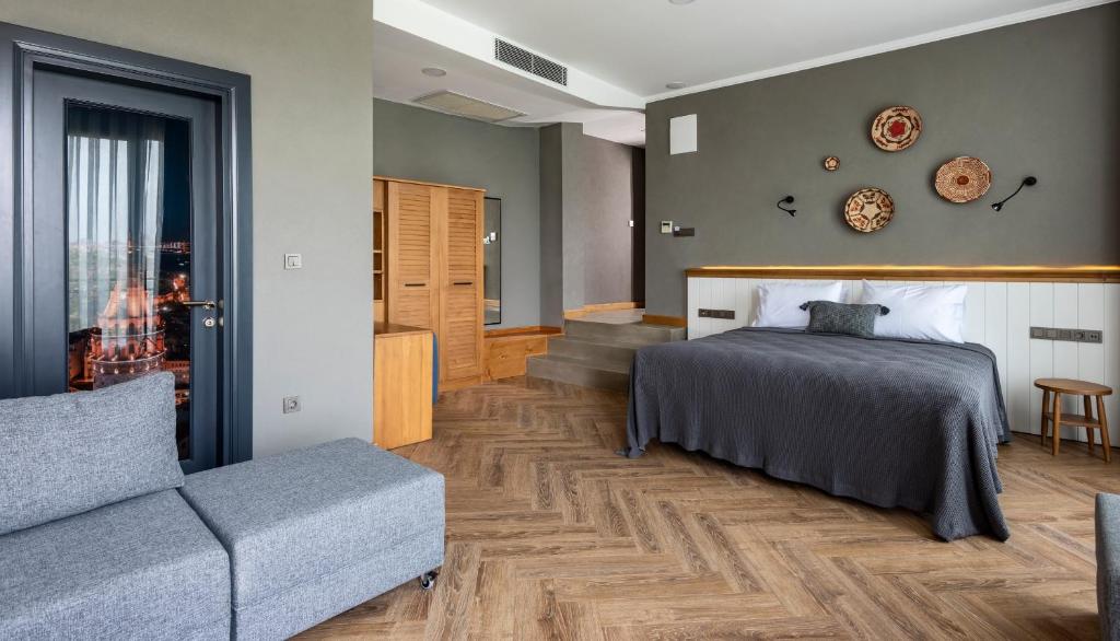 A bed or beds in a room at Istanbul Old City Colorful Houses Balat PETRION Hotel