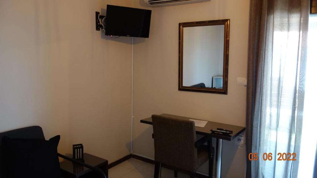 Telewizja i/lub zestaw kina domowego w obiekcie VAGGELIO Rooms 1