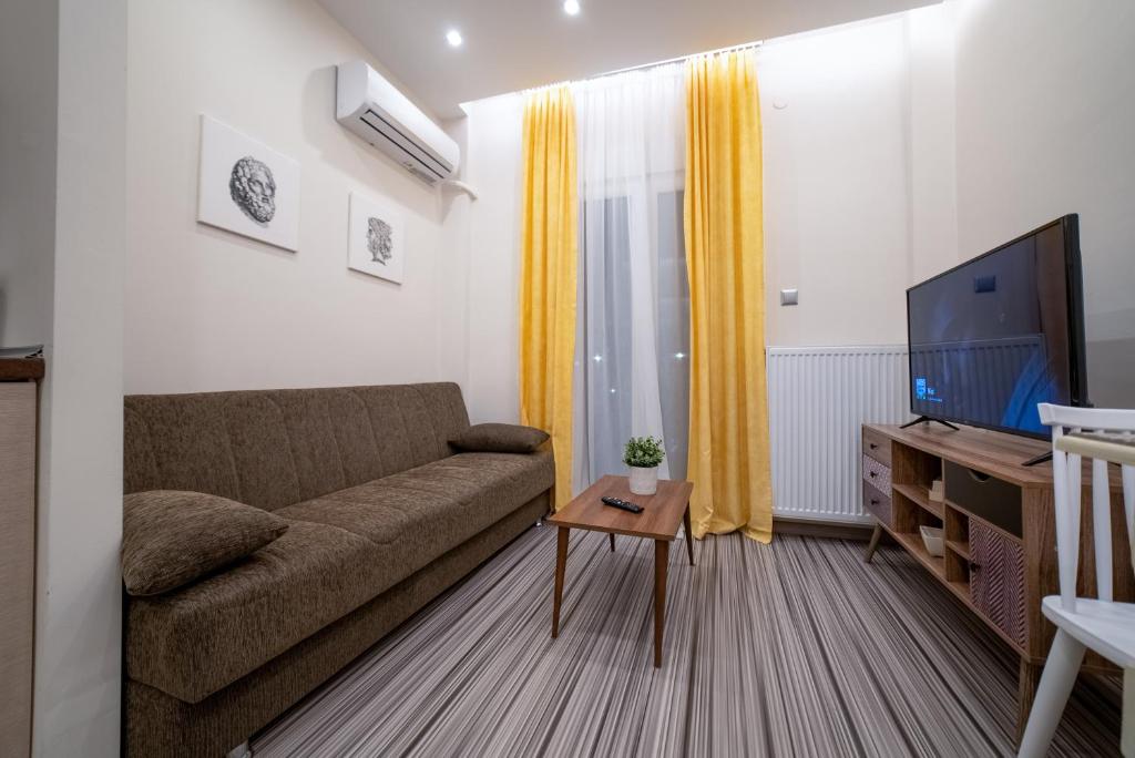 Televízia a/alebo spoločenská miestnosť v ubytovaní Luxury Suites with KING-SIZED bed