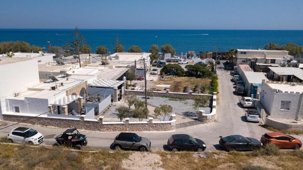 an aerial view of a parking lot near the ocean at Kasteli Suites in Perivolos