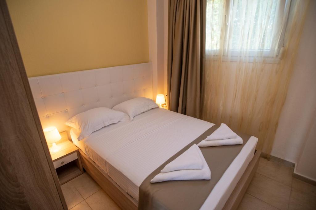 Postel nebo postele na pokoji v ubytování Lagaria Apartments