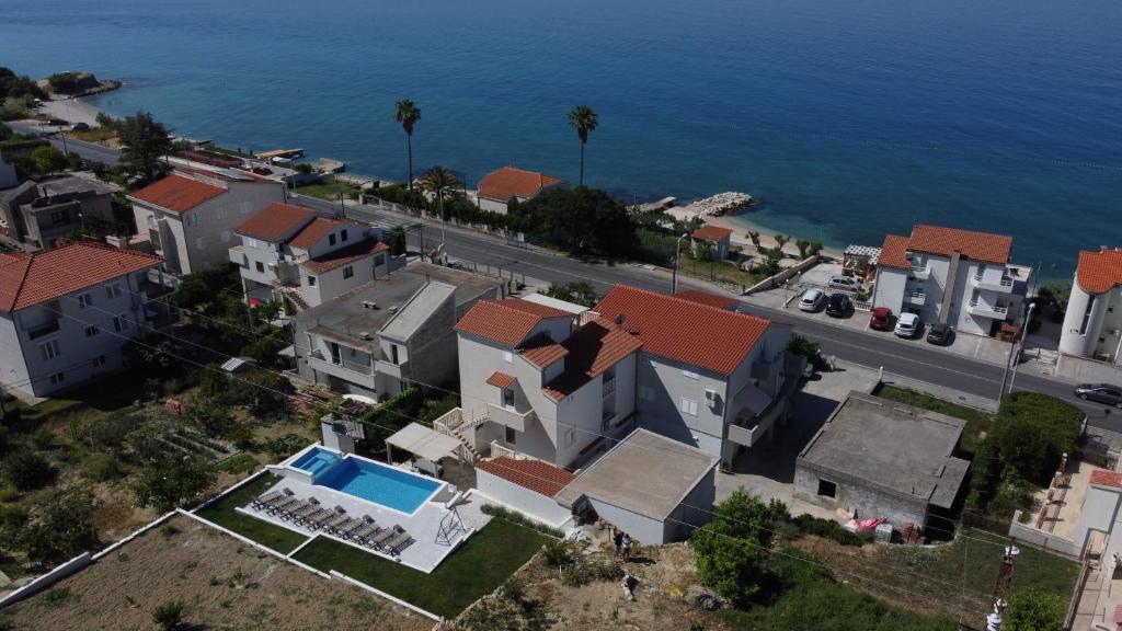 an aerial view of a house next to the ocean at Apartments Jagoda in Podstrana
