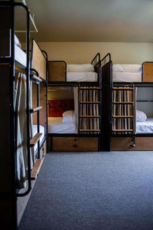 Postel nebo postele na pokoji v ubytování KEX Hotel