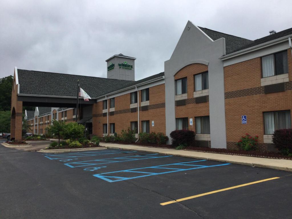 an empty parking lot in front of a hotel at Wingate by Wyndham Brighton in Brighton