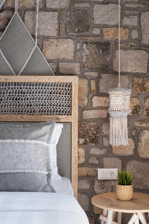 A bed or beds in a room at LemnosThea Luxury Villas