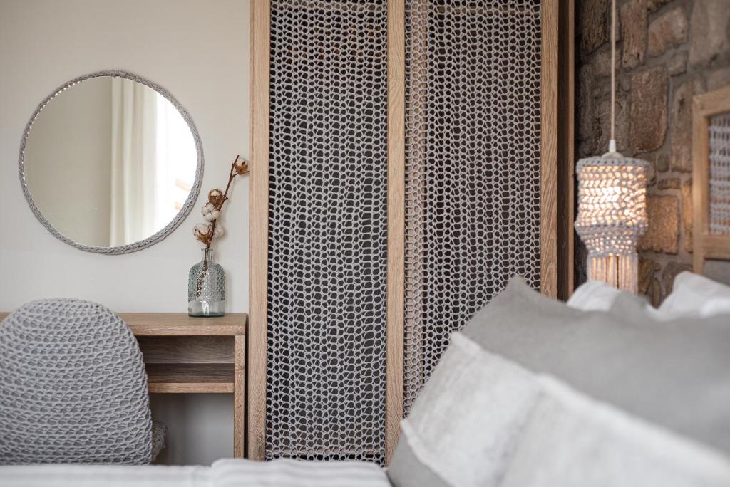 A bed or beds in a room at LemnosThea Luxury Villas