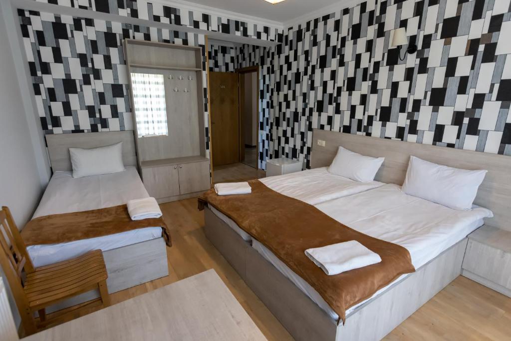 Postel nebo postele na pokoji v ubytování GP Rooms