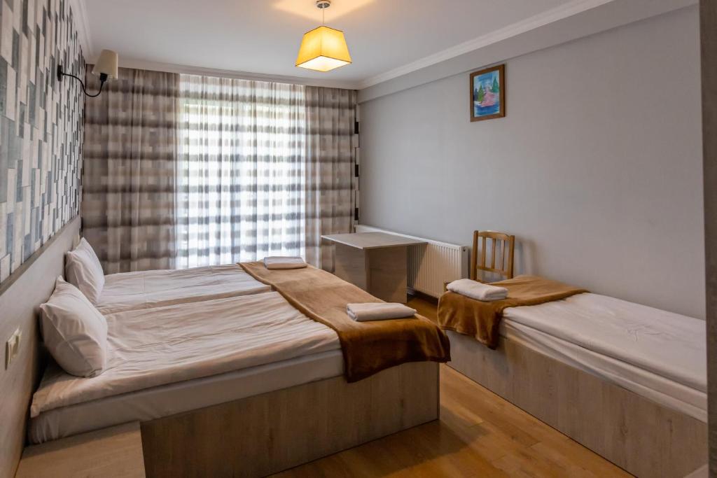 Postel nebo postele na pokoji v ubytování GP Rooms