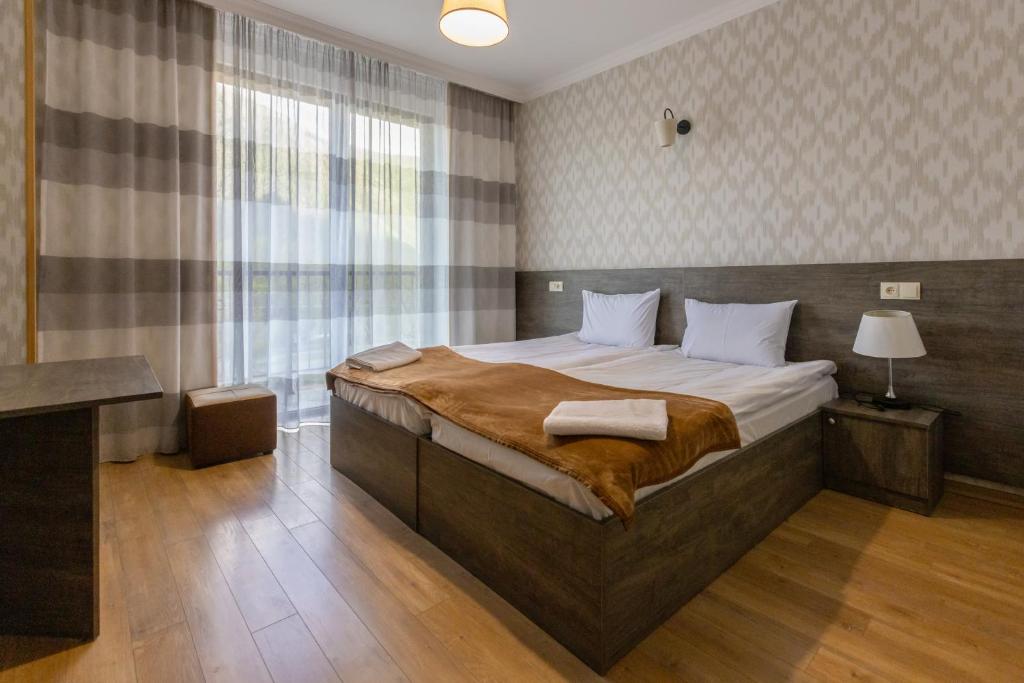 Postel nebo postele na pokoji v ubytování GP Rooms