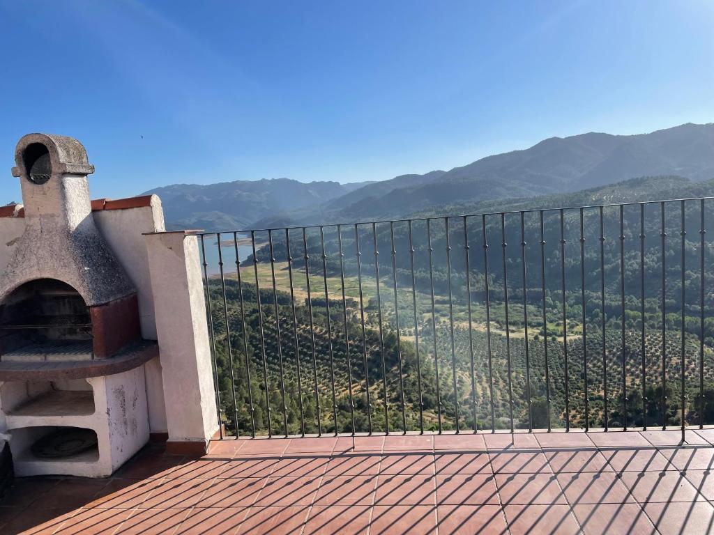 a balcony with a view of a mountain at Apartamentos Adarve in Hornos