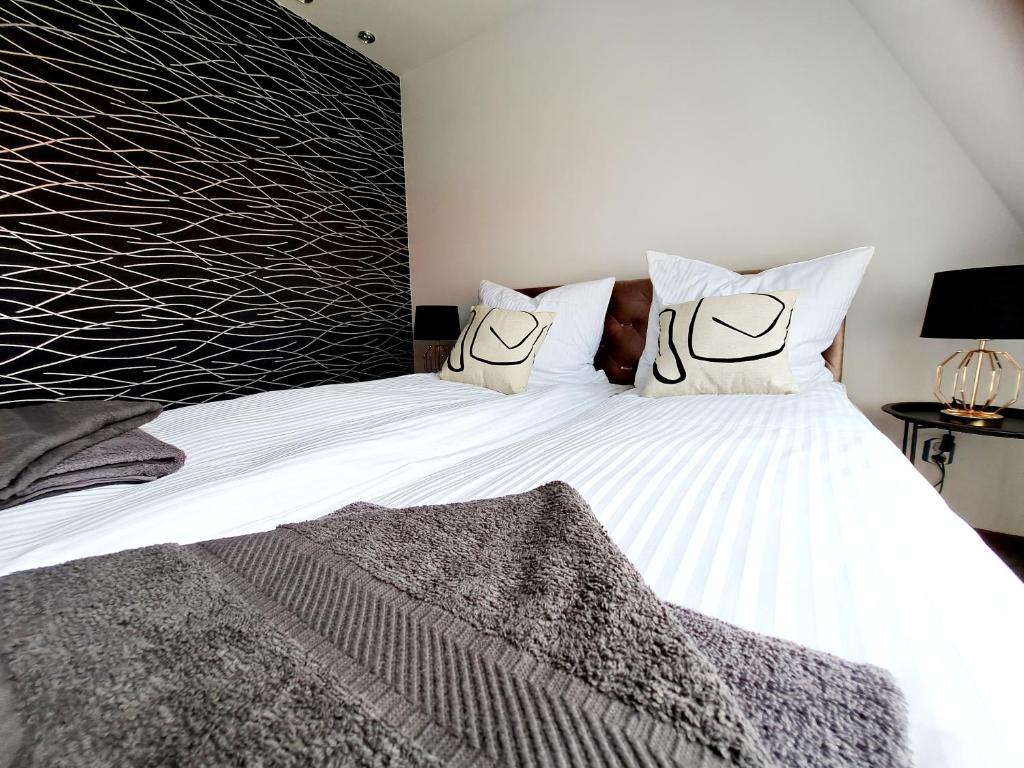Posteľ alebo postele v izbe v ubytovaní OASIS APARTAMENT GIŻYCKO