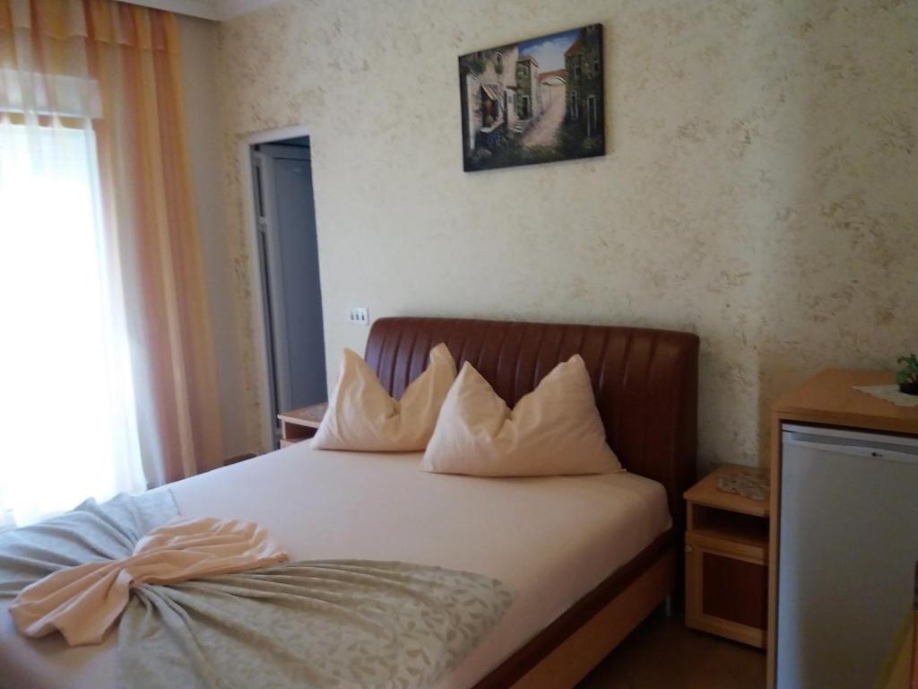 Postel nebo postele na pokoji v ubytování Apartmants Elisa