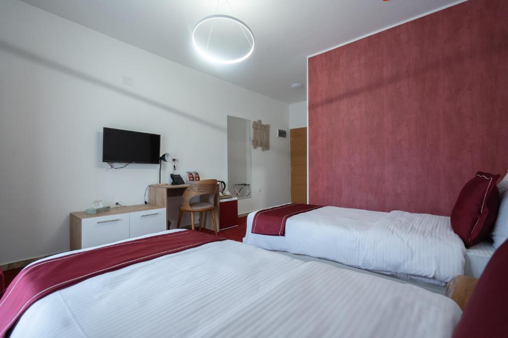 Postel nebo postele na pokoji v ubytování Austrian Palace Hotel