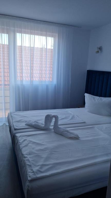 Postel nebo postele na pokoji v ubytování ADMAR Rooms & Restaurant