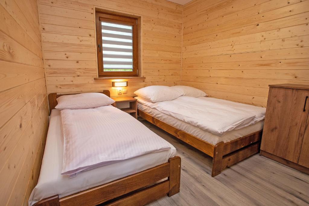 Posteľ alebo postele v izbe v ubytovaní Apartamenty u Bartka i Magdy