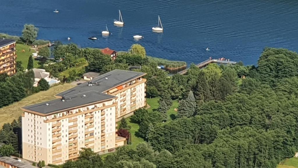 an aerial view of a building with boats in the water at Ferienwohnung Eichenseher in Bodensdorf