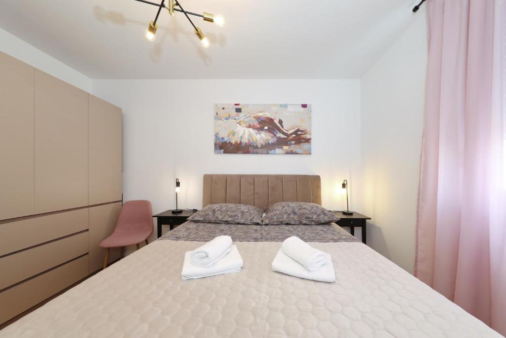 Posteľ alebo postele v izbe v ubytovaní Apartman Maresa
