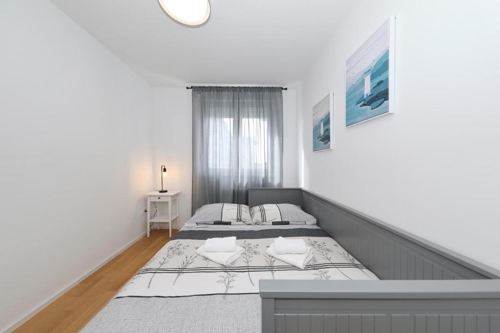 Posteľ alebo postele v izbe v ubytovaní Apartman Maresa