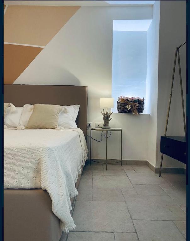 Łóżko lub łóżka w pokoju w obiekcie B&B Torre Sibissi Bari