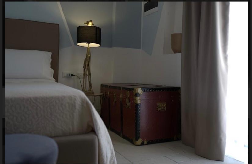 Łóżko lub łóżka w pokoju w obiekcie B&B Torre Sibissi Bari